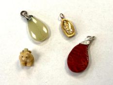 Four vintage pendants.