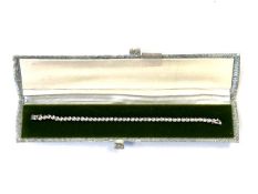 A 9ct gold diamond set tennis bracelet.