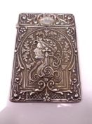 A silver card case with embossed decoration