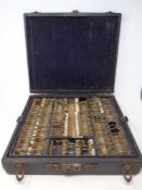 An optician's wooden case containing lenses