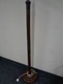 A 20th century carved hardwood standard lamp in Oriental style