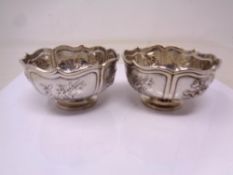 Two Chinese silver embossed dishes.