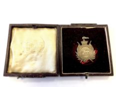 A silver Southern Rhodesia Volunteers shooting medal named to Cpl S H Smith, H Squadron,