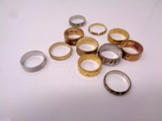 A quantity of brass sample wedding band rings.