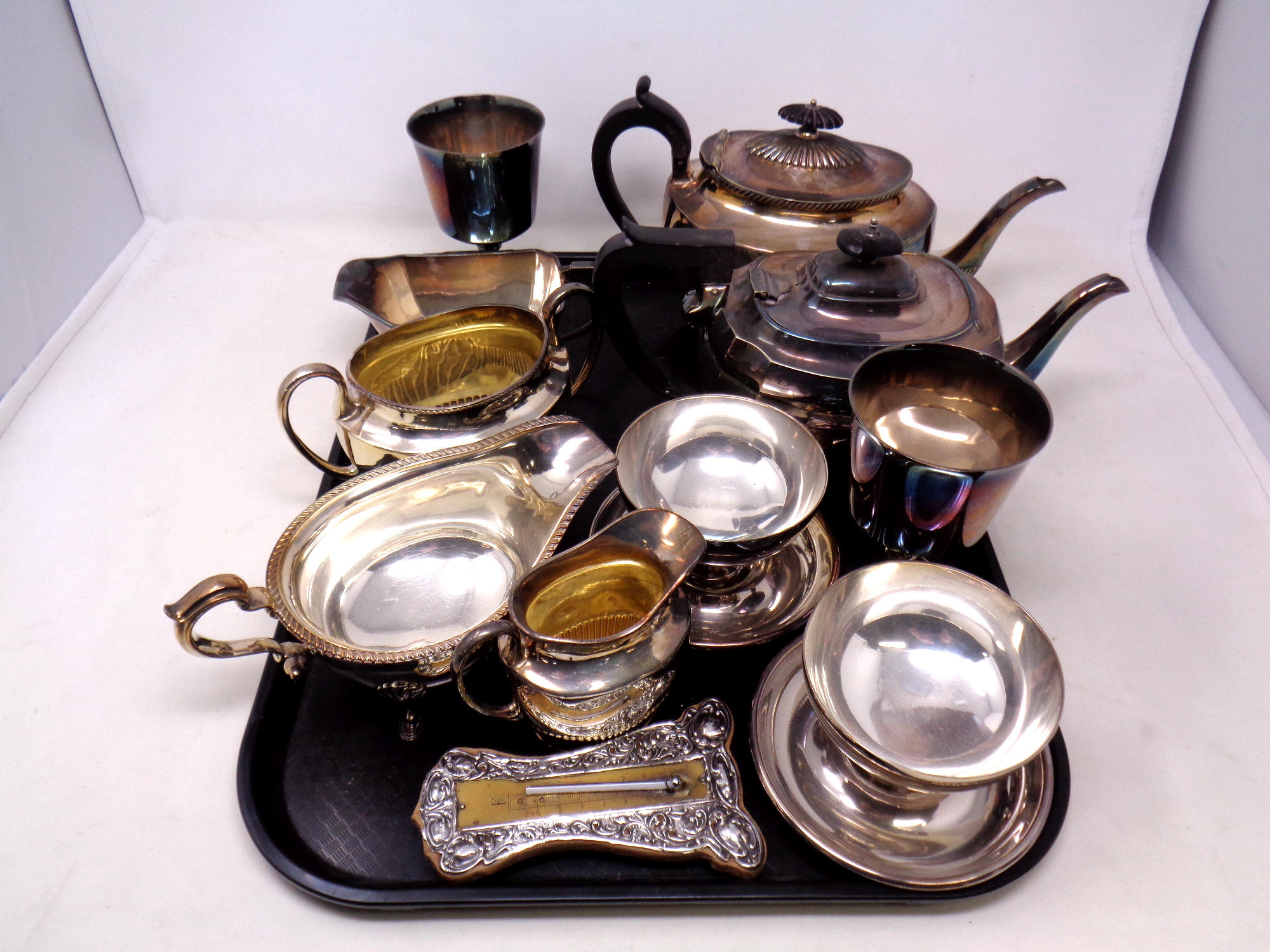 A tray of silver plated part tea set, gravy boat,