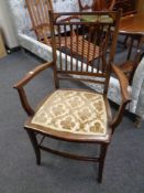 A late Victorian inlaid mahogany rail backed armchair