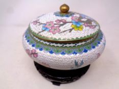 A cloisonne lidded pot on stand together with a further ceramic muffin dish on stand