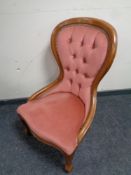 A Victorian style bedroom chair in pink dralon