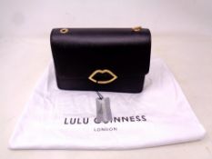A Lulu Guinness Black leather hand bag with retail pouch.