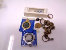 A small amount of costume jewelry. Dress ring, medallion etc.