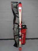 A pair of Rossignol skis in bag together with a golf bag containing Mizuno irons