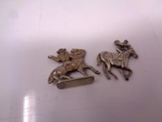 Two horse charms.