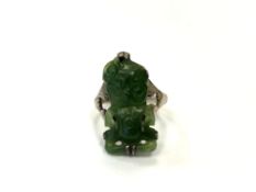 A silver and jade hei tiki ring