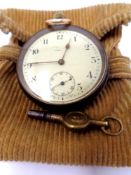 A small white metal fob watch, the internal case stamped Omega, with key and pouch.