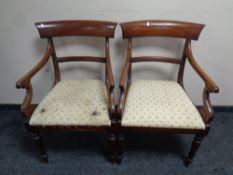A pair of Victorian mahogany armchairs