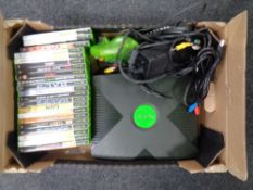 A box containing Xbox with leads and controller together with twenty one games