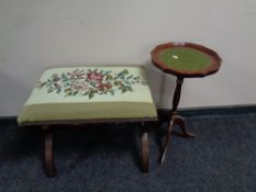 A mahogany tapestry upholstered stool on X-framed legs together with a wine table