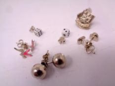 5 pairs of silver earrings.