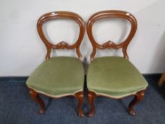 A pair of Victorian balloon backed chairs