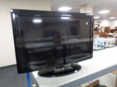 An Evotel 32 inch LCD TV with remote