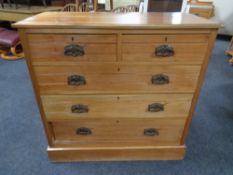 An Edwardian five drawer chest with drop handles