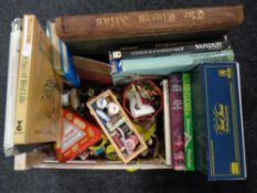 A box of assorted board games, sewing accessories, chess pieces, playing cards,