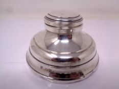 A silver Capstan inkwell.