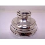 A silver Capstan inkwell.