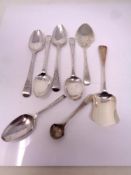 A small collection of silver cutlery including teaspoons, scoop mustard spoon, 108g.