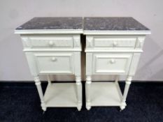 A pair of antique French bedside tables with marble tops