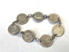 A bracelet made from old 3 pence Silver coins.