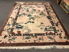 A Chinese style carpet on pink ground,