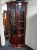 An Indonesian mahogany double door corner cabinet, Height 200 cm, width 90 cm, depth 56.5 cm.