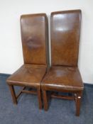 A pair of contemporary high backed brown leather dining chairs