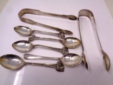 A small quantity of silver cutlery including sugar tongs and tea spoons, 165 g.