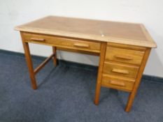 A 20th century oak single pedestal desk