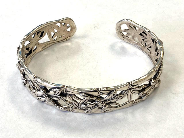 A Silver dragonfly cuff bracelet.