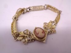 A silver cameo bracelet.