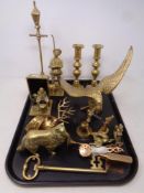 A tray of brass including candlesticks,