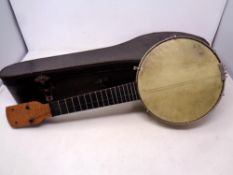 A vintage ukulele in case