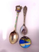 Two silver and enamel spoons together with a brooch.