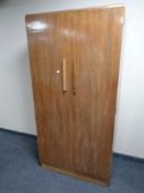 A twentieth century mahogany double door wardrobe