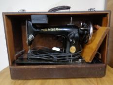 A Singer electric sewing machine in case with pedal