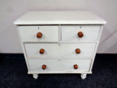 An antique pine four drawer painted chest