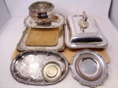 A silver plated breakfast dish with cover together with serving trays,