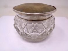 A silver topped glass dressing table jar.