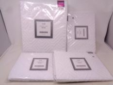 A Dunelm double duvet cover set together with three pillow cases in woven cotton