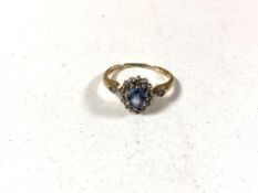 A traditional style Sapphire and Diamond ring mounted in yellow gold.