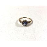 A traditional style Sapphire and Diamond ring mounted in yellow gold.