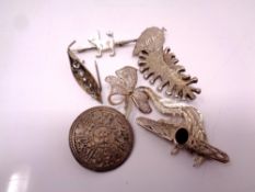 Eight silver brooches.